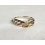 A 9ct gold and silver entwined  Ring size M