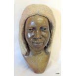 A stone carved African bust 28 x 15