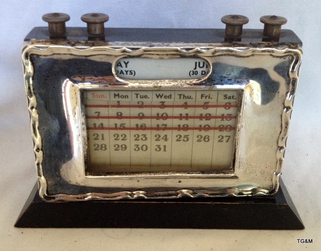 A silver fronted perpetual calendar