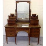 An Edwardian mahogany inlaid dressing table with swing mirror