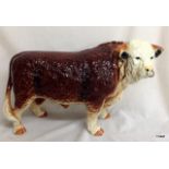 A large porcelain model bull 26 x 42 x 14