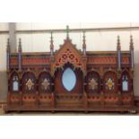 A highly ornate, hand carved and hand decorated oak Religious shrine usually found in a small