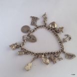 A silver charm bracelet and 12 charms