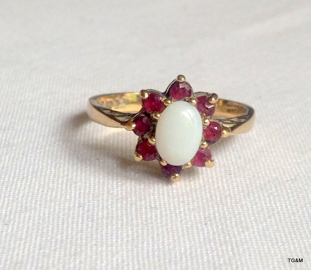 A 9ct gold opal and garnet ring size N