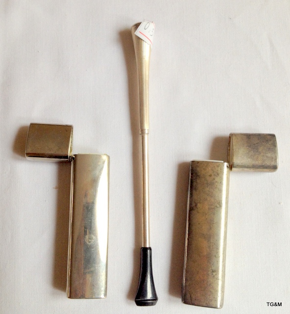 An extending white metal cigarette holder and two matching toothpick holders