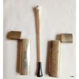 An extending white metal cigarette holder and two matching toothpick holders