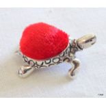 A sterling silver tortoise pin cushion