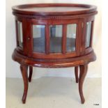 A mahogany butlers tray on glazed cabinet with carved frieze 81 x 70 x 48cm