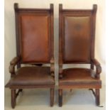 A pair of Oak framed carved leather throne style chairs