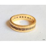 An 18ct gold eternity ring, size L