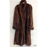 A ladies full length fur coat