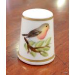 An M Munslow Royal Worcester hand painted thimble depicting a robin