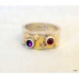 a designer gold on silver Amethyst and garnet bullet ring, Birmingham