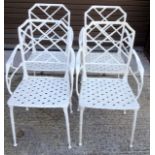 A set of 4 white painted cast metal garden chairs 89 x 51