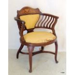 An Edwardian inlaid Nursing chair