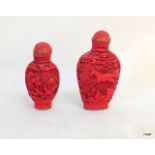 A pair of Chinese Cinnabar snuff bottles marks to the base