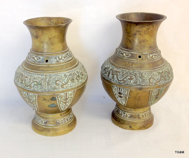 A pair of Islamic bronze vases 20cm