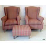 A pair of wing back chairs and matching foot stool