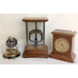 A Bulle Electro clock missing dial in a full glass case, a glass domed small anniversary clock and a