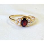 A 9ct gold garnet ring size R