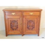 An Edwardian Mahogany Sideboard with carving to the doors 93 x 120 x 38
