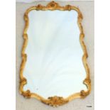 A gilt frame mirror in the Rococo style 100 x 85