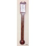 A wall mounted stick barometer made by Rapport of London with mahogany case