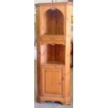 A pine wood 1 drawer and 1 door tall corner display unit 191 x 70 x 38