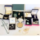 A mixed collection of costume jewellery boxed to include collar studs