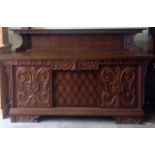 An Art Nouveau 1 drawer oak sideboard with overshelf and ornate carved front 120 x 195 x 54