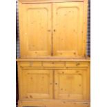 A Victorian pine Kitchen cupboard 2 upper doors with three drawers below and 2 further down in two