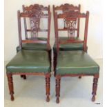 Set of 4 carved walnut dining chairs with green leatherette upholstery. 90cm high