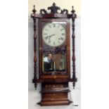 A mahogany inlaid wall clock with  fretwork inside, twisted columns chiming  92 x 39 x 15