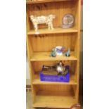 A pine bookcase with three shelves