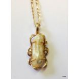 A 9ct gold mother of pearl  and diamond pendant and chain