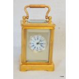 A miniature brass cased carriage clock