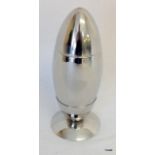 A silver plated missile shaped cocktail shaker