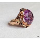 A gold and amethyst ring, size I
