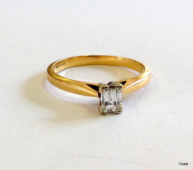 An 18ct gold oblong diamond solitaire approx 0.38ct size L