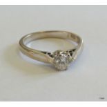 An 18ct white gold diamond solitaire 0.25ct size M