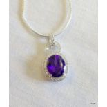 A silver CZ and Amethyst pendant necklace