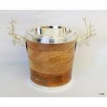 A silver plated ice bucket with stag handles to the sides