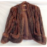 A ladies short fur coat by De Bella