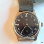 A Military Omega W.W.W. Wristwatch fitted with a 30T2 calibre movement backed W.W.W with broad arrow