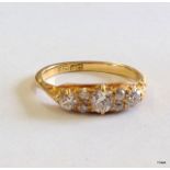 An 18ct gold diamond 7 stone ring approx 0.60ct size M/N