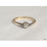 An 18ct gold and platinum diamond solitaire ring size P