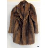 A ladies 3/4 fur coat