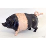 A cold painted bronze desk bell in the form of a pig