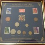 The framed Queen Elizabeth II coronation 1953 celebration stamps and coins