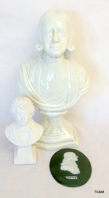 A white glazed pottery bust of John Wesley, plaque and a bust of Schubert